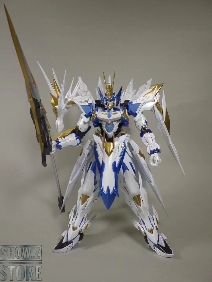 White and blue mecha with golden accents and wings White and blue mecha with golden accents and wings