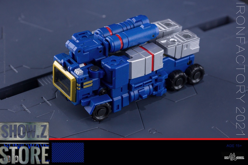 Dark robot holding large cannon weapon in combat stance Dark robot holding large cannon weapon in combat stance