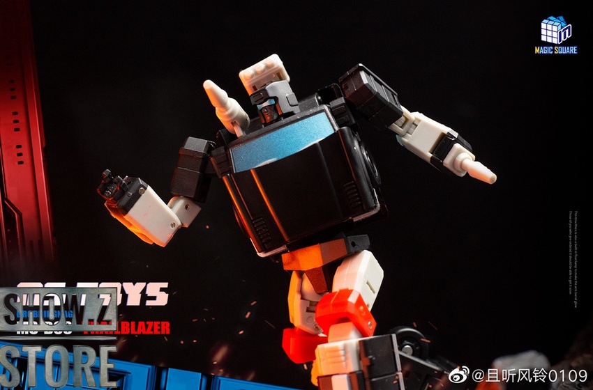 Orange robot with extended double-bladed weapons in action stance Orange robot with extended double-bladed weapons in action stance