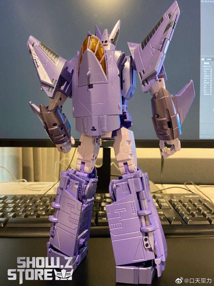 Eligos purple transformer robot in action pose with sword Eligos purple transformer robot in action pose with sword