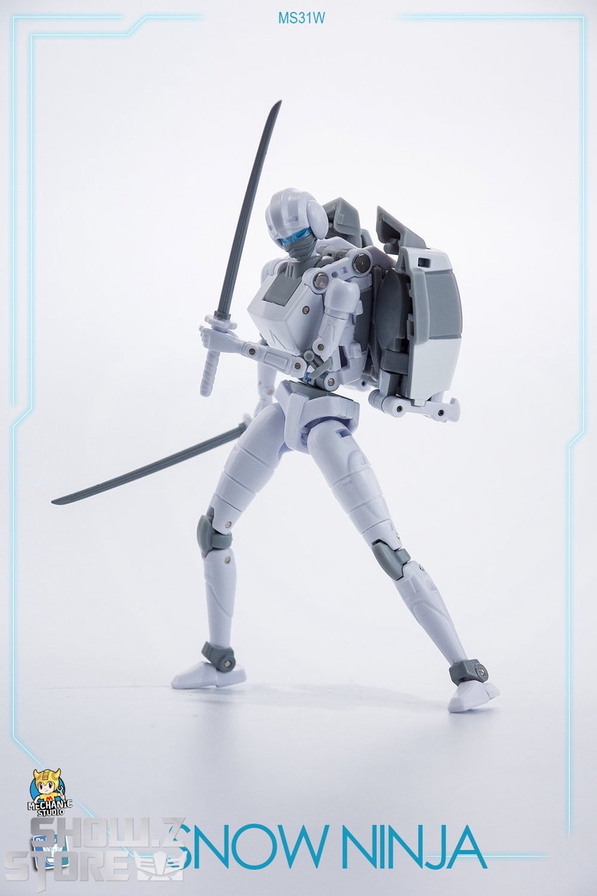 Arcee standing with dual curved blade weapons display Arcee standing with dual curved blade weapons display