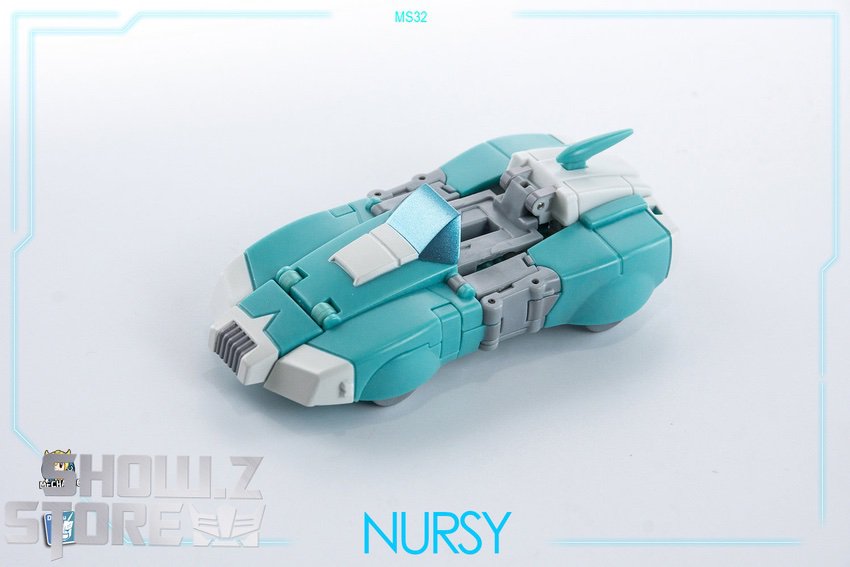 Arcee robot mode teal white suit rifle action stance ready Arcee robot mode teal white suit rifle action stance ready