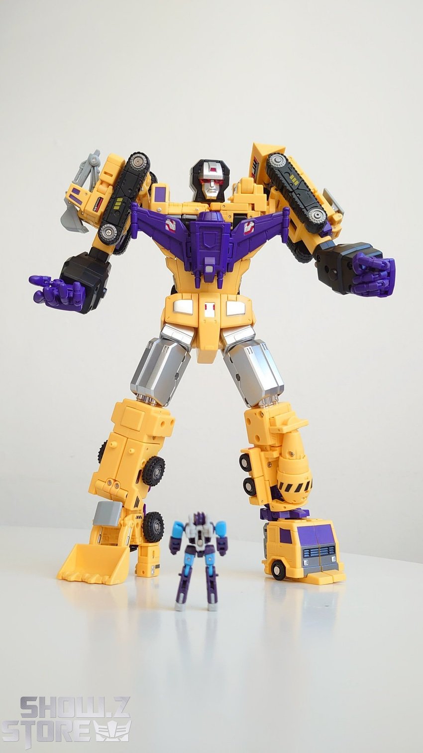 NewAge H34Y Hephaestus Devastator G2 yellow purple robot standing NewAge H34Y Hephaestus Devastator G2 yellow purple robot standing