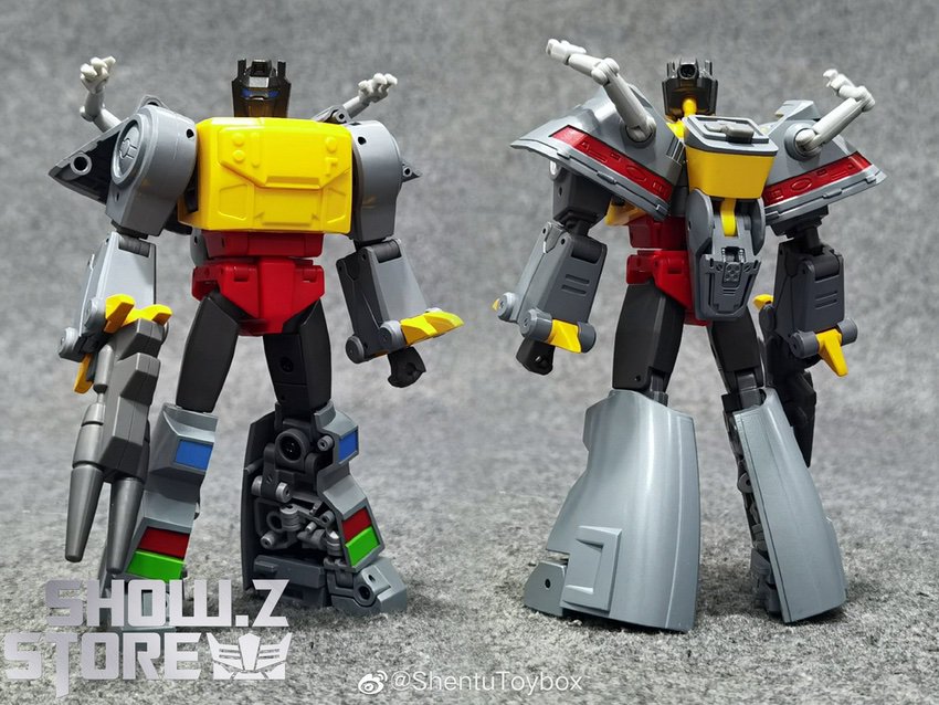 NewAge Grimlock yellow robot holding red blade action stance NewAge Grimlock yellow robot holding red blade action stance
