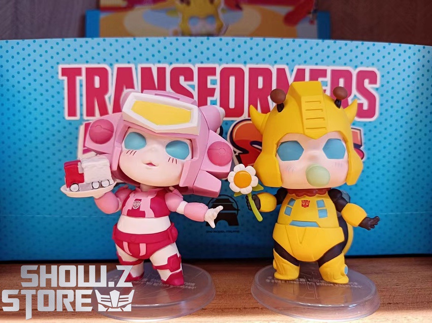 Pink yellow Transformers Kindergarten characters posing together display Pink yellow Transformers Kindergarten characters posing together display