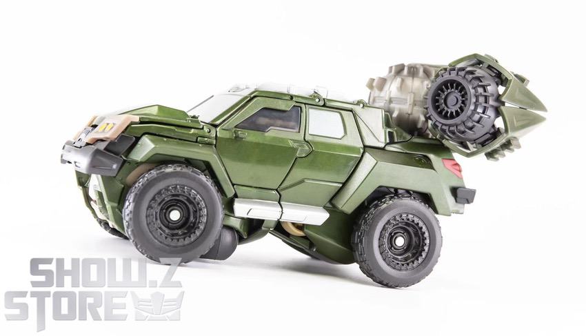 Bulkhead green truck detailed cabin articulated mechanical parts display Bulkhead green truck detailed cabin articulated mechanical parts display