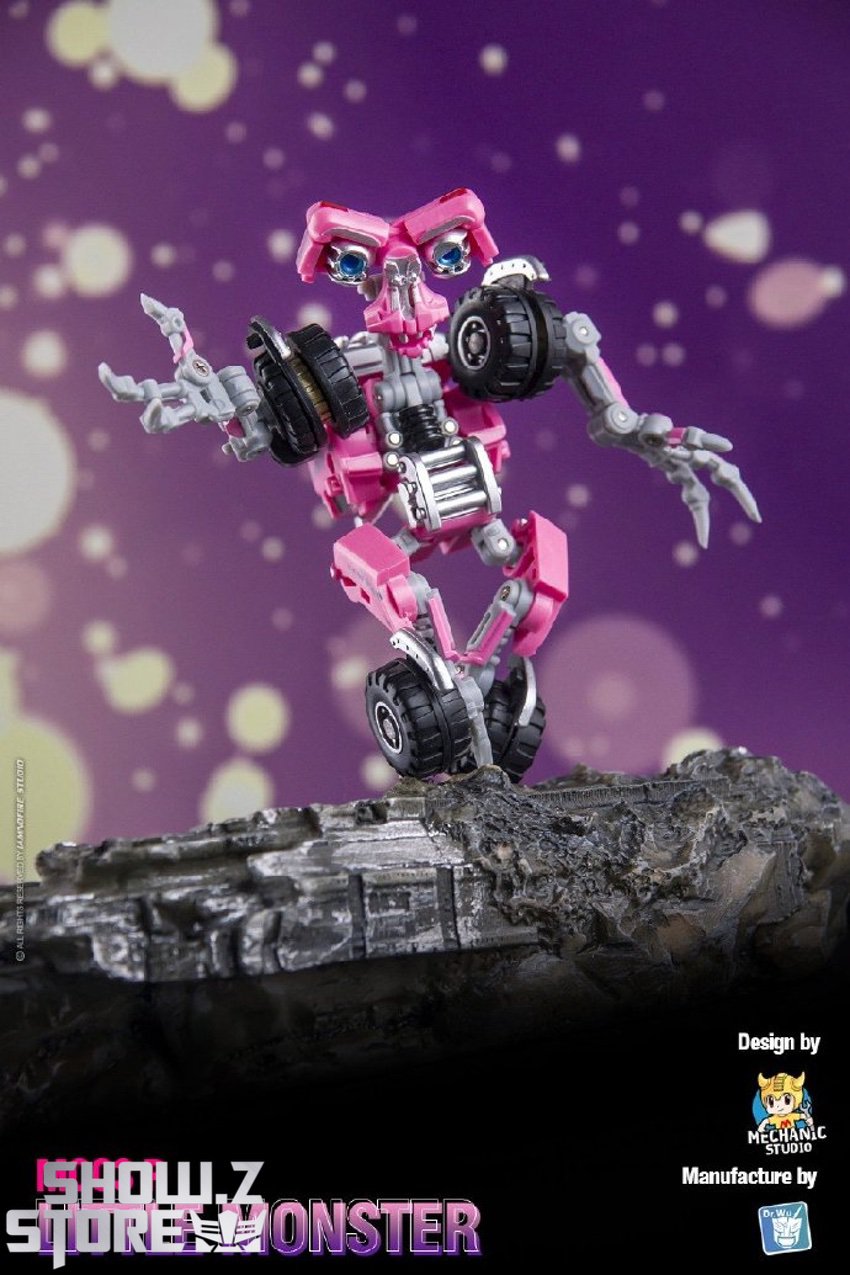 MC03 Wheelie pink transformer robot jumping attack pose display MC03 Wheelie pink transformer robot jumping attack pose display