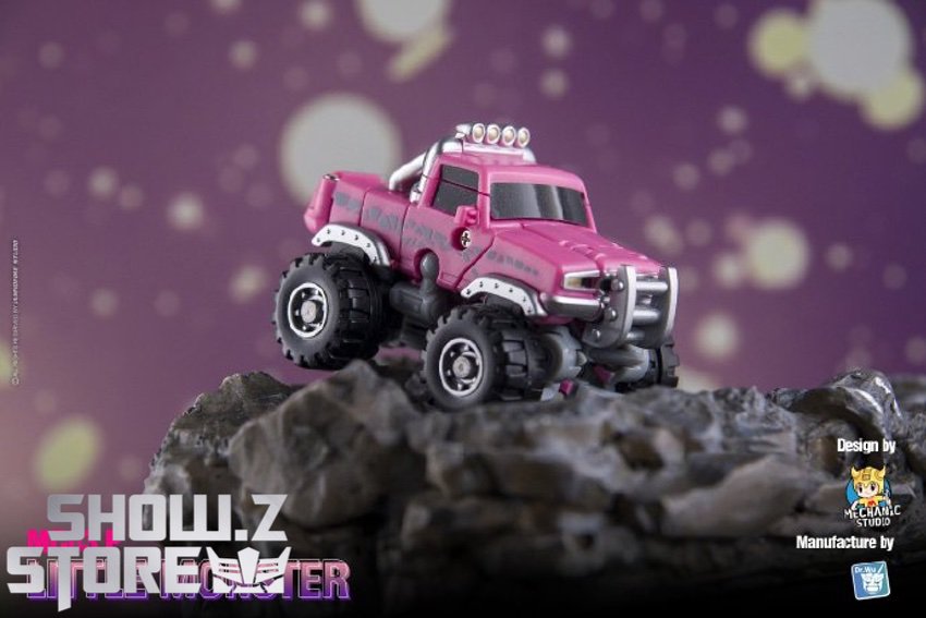 Dr.Wu Wheelie pink monster truck robot mid-action dynamic pose Dr.Wu Wheelie pink monster truck robot mid-action dynamic pose
