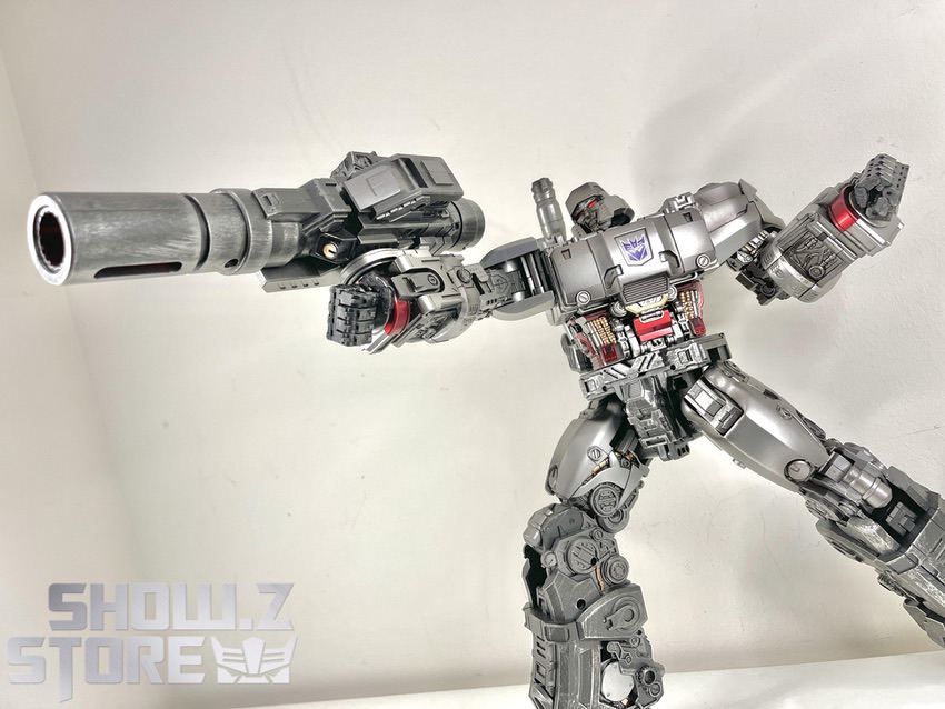 Megatron silver gray firing cannon arm extended sideways Megatron silver gray firing cannon arm extended sideways