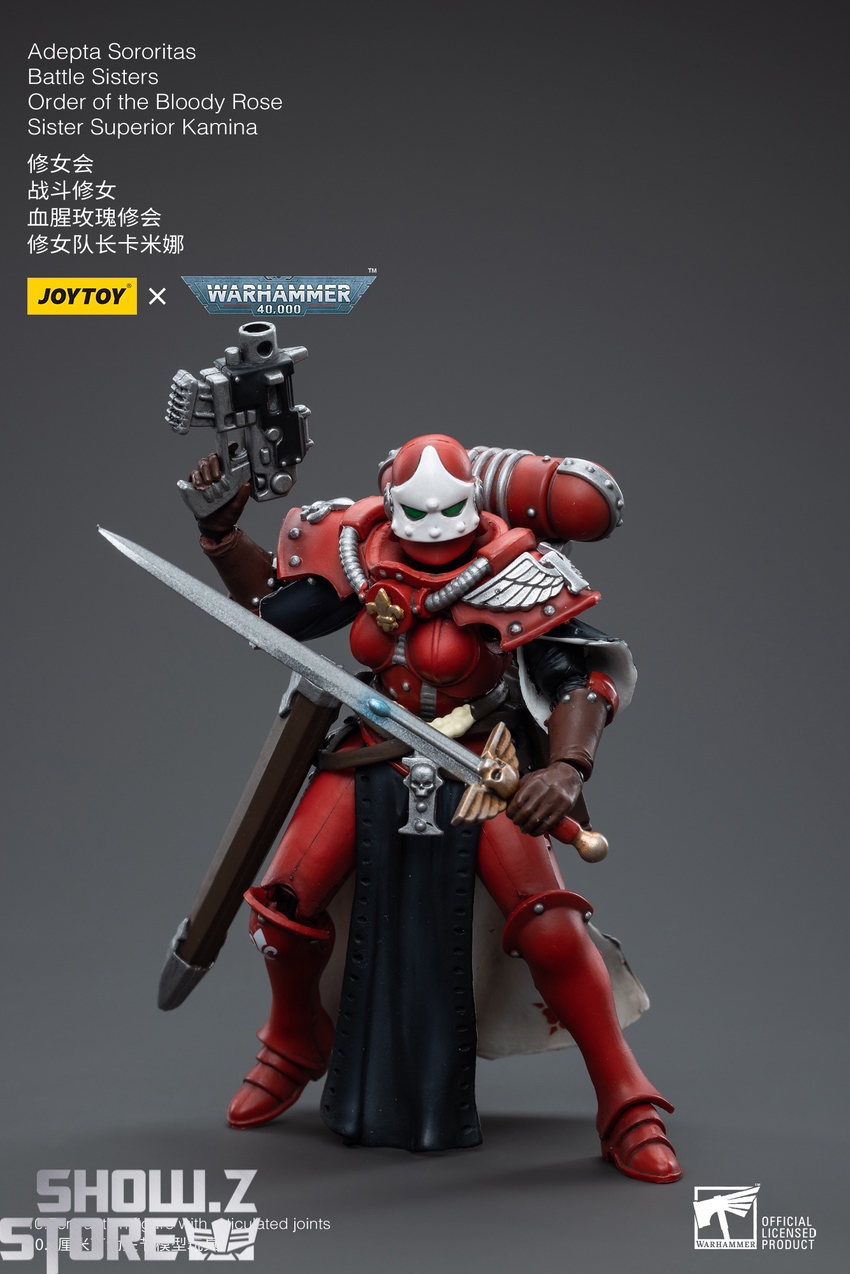 JoyToy Warhammer 40K Kamina holding plasma cannon and heavy blade in action pose JoyToy Warhammer 40K Kamina holding plasma cannon and heavy blade in action pose