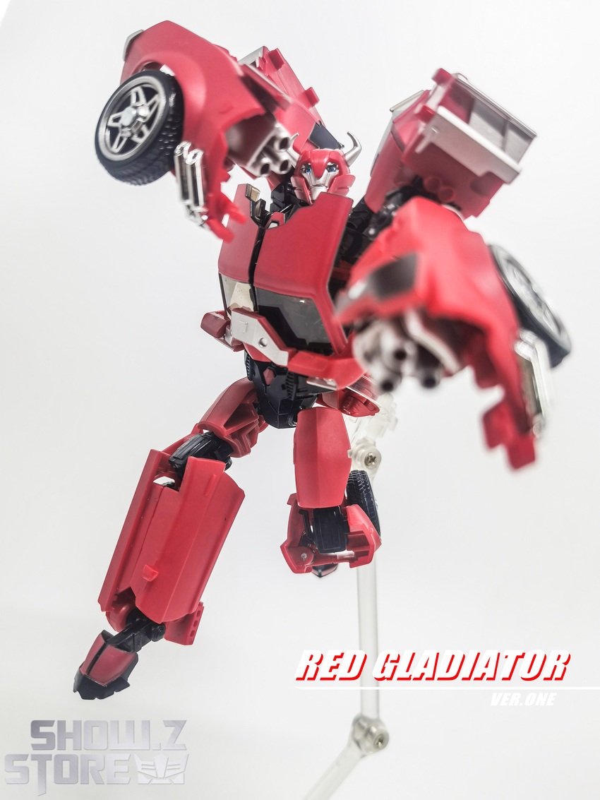 Red Gladiator Cliffjumper action figure extended arm display Red Gladiator Cliffjumper action figure extended arm display