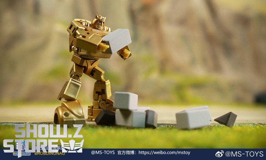 Gold metallic bumblebee robot with white accents standing tall Gold metallic bumblebee robot with white accents standing tall