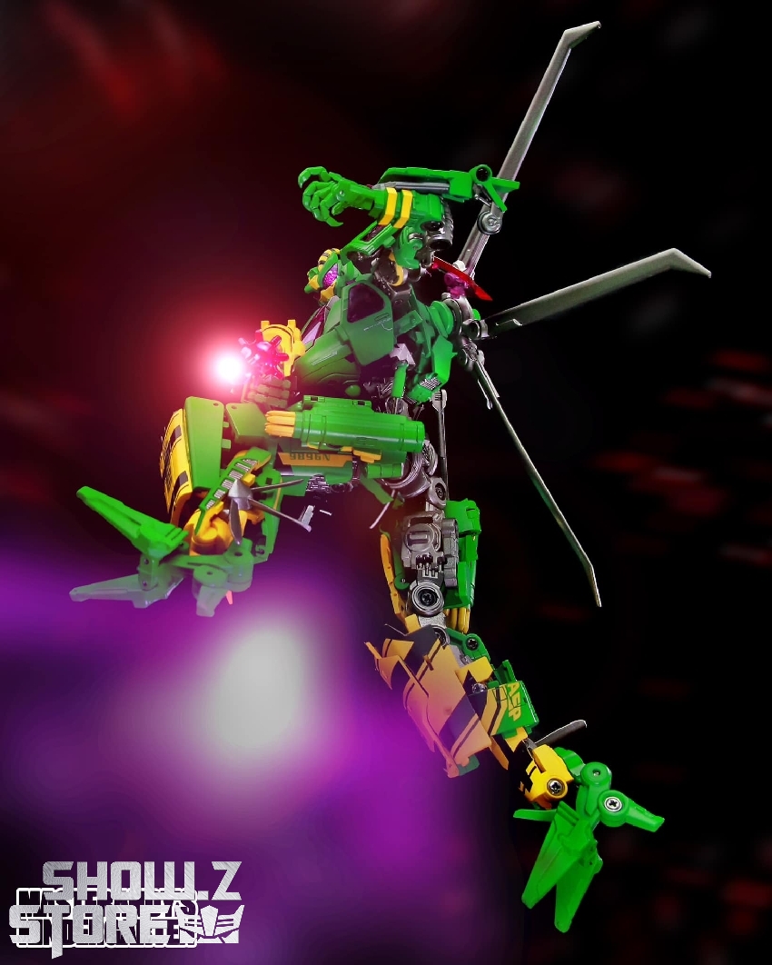 Waspinator green yellow robot aerial pose with pink energy effects Waspinator green yellow robot aerial pose with pink energy effects