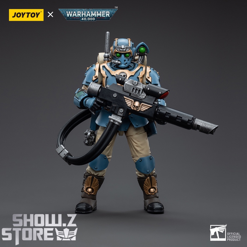 Astra Militarum soldier in detailed blue and tan suit with mounted weapon system Astra Militarum soldier in detailed blue and tan suit with mounted weapon system