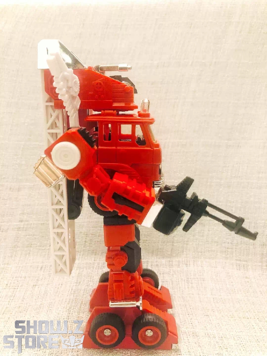 G1 Inferno red fire truck robot standing upright transformation pose G1 Inferno red fire truck robot standing upright transformation pose