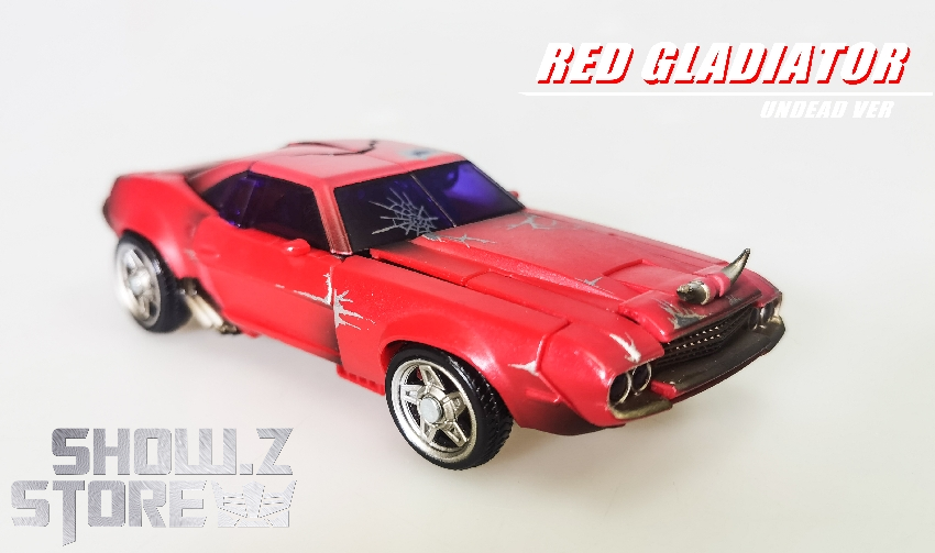 Damaged red car with zombie character details visible Damaged red car with zombie character details visible
