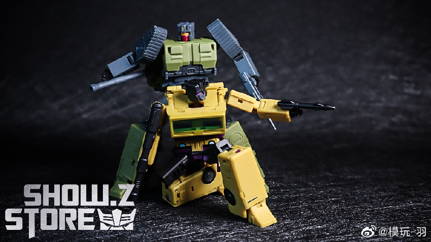 Yellow robot warrior displayed in aggressive stance with detailed armor pieces Yellow robot warrior displayed in aggressive stance with detailed armor pieces