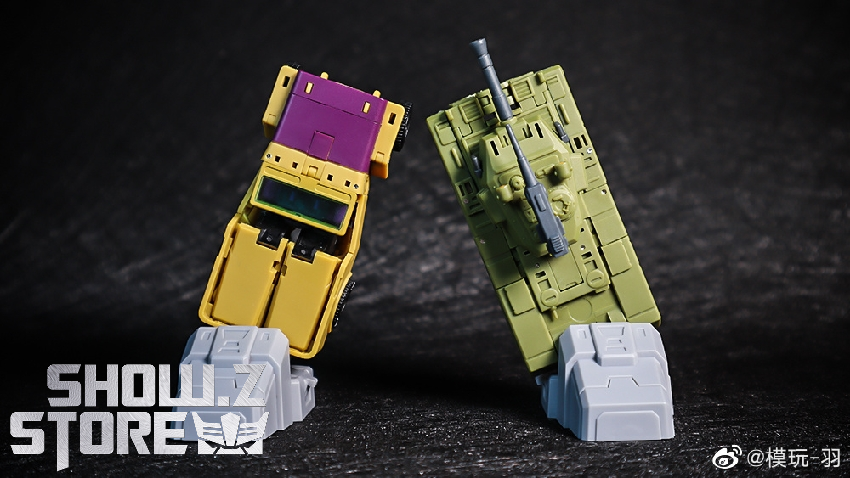 Purple and yellow robot warrior in standing combat position with extended weapons Purple and yellow robot warrior in standing combat position with extended weapons