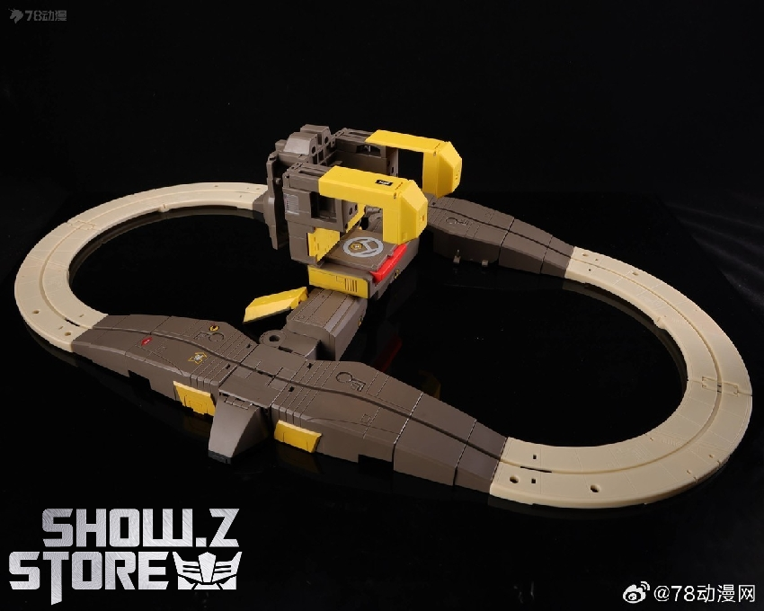 Toy figure with articulated track base and large cannon accessory system Toy figure with articulated track base and large cannon accessory system