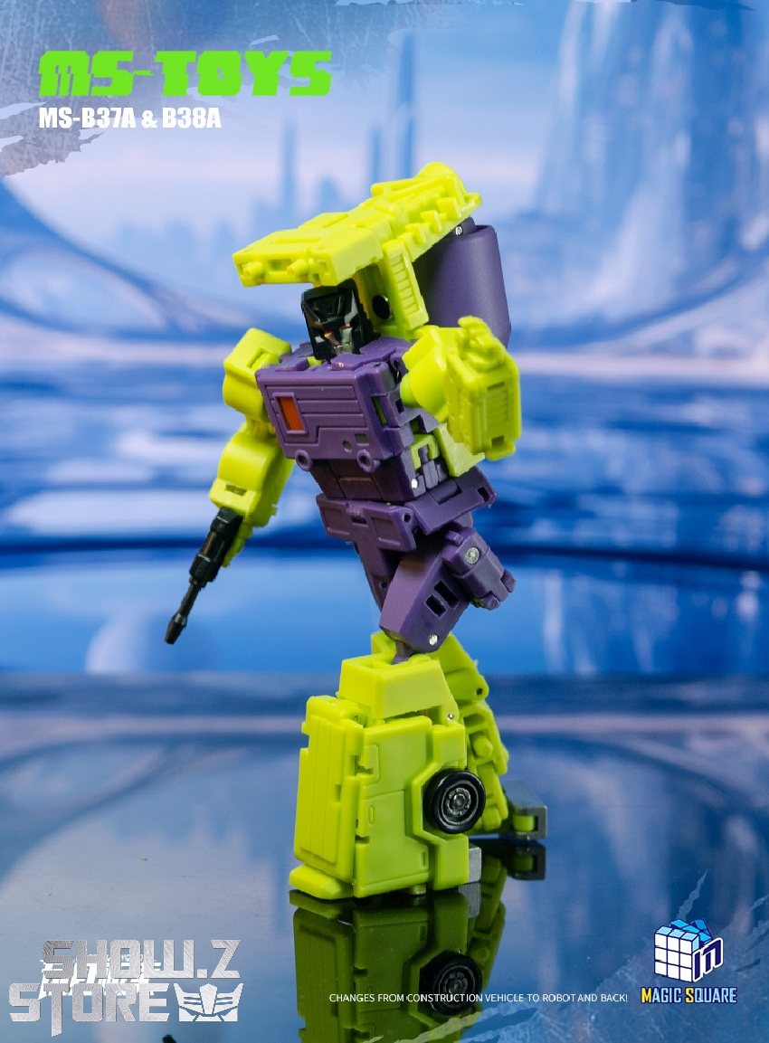 Magic Square MS-B37 Scrapper yellow robot in standing pose on blue background Magic Square MS-B37 Scrapper yellow robot in standing pose on blue background