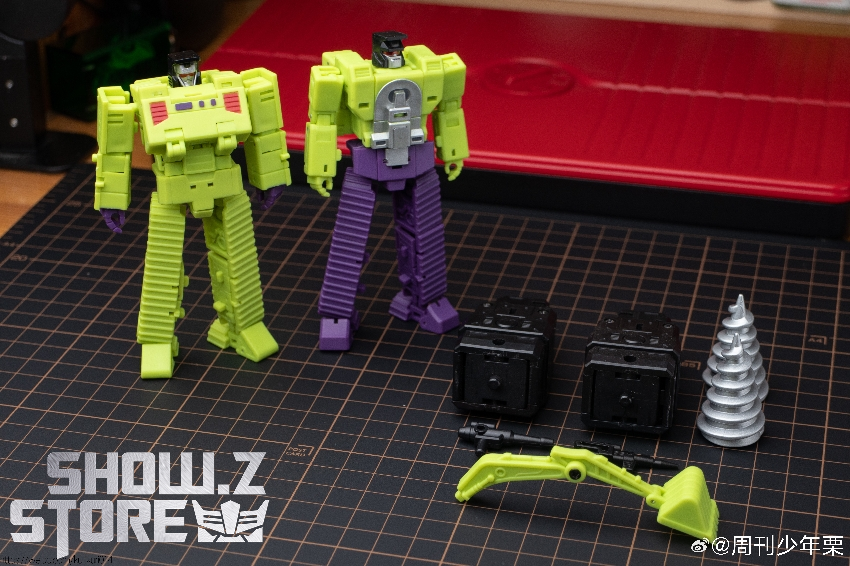 Magic Square yellow and purple robot figures in humanoid robot mode Magic Square yellow and purple robot figures in humanoid robot mode