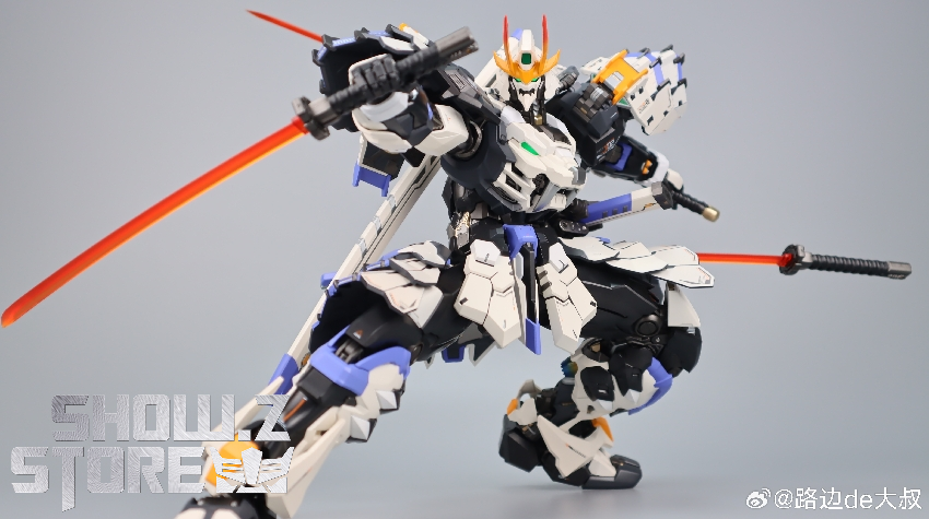 White blue and orange mobile suit warrior figure with blade weapons White blue and orange mobile suit warrior figure with blade weapons