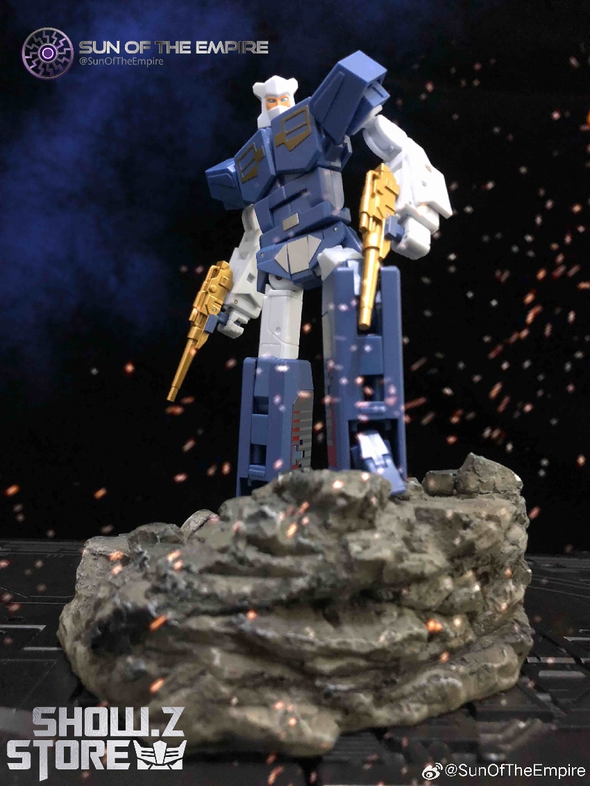 Blue robot figure on rocky terrain showing complete transformation detail and weapons Blue robot figure on rocky terrain showing complete transformation detail and weapons