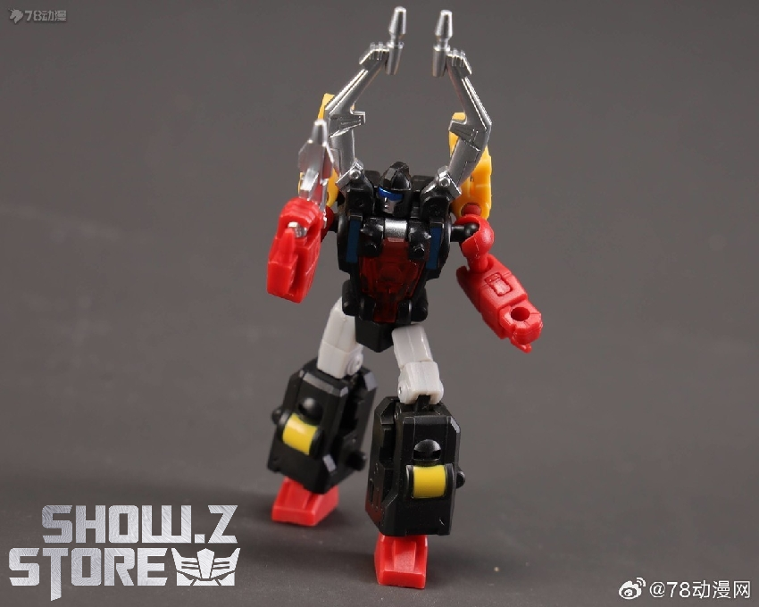 Red and blue Insecticon robot figure with articulated legs in combat ready stance Red and blue Insecticon robot figure with articulated legs in combat ready stance