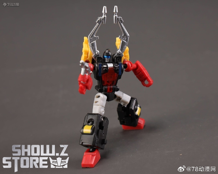 Blue and red robot Insecticon sitting on package box showing vehicle and robot modes Blue and red robot Insecticon sitting on package box showing vehicle and robot modes