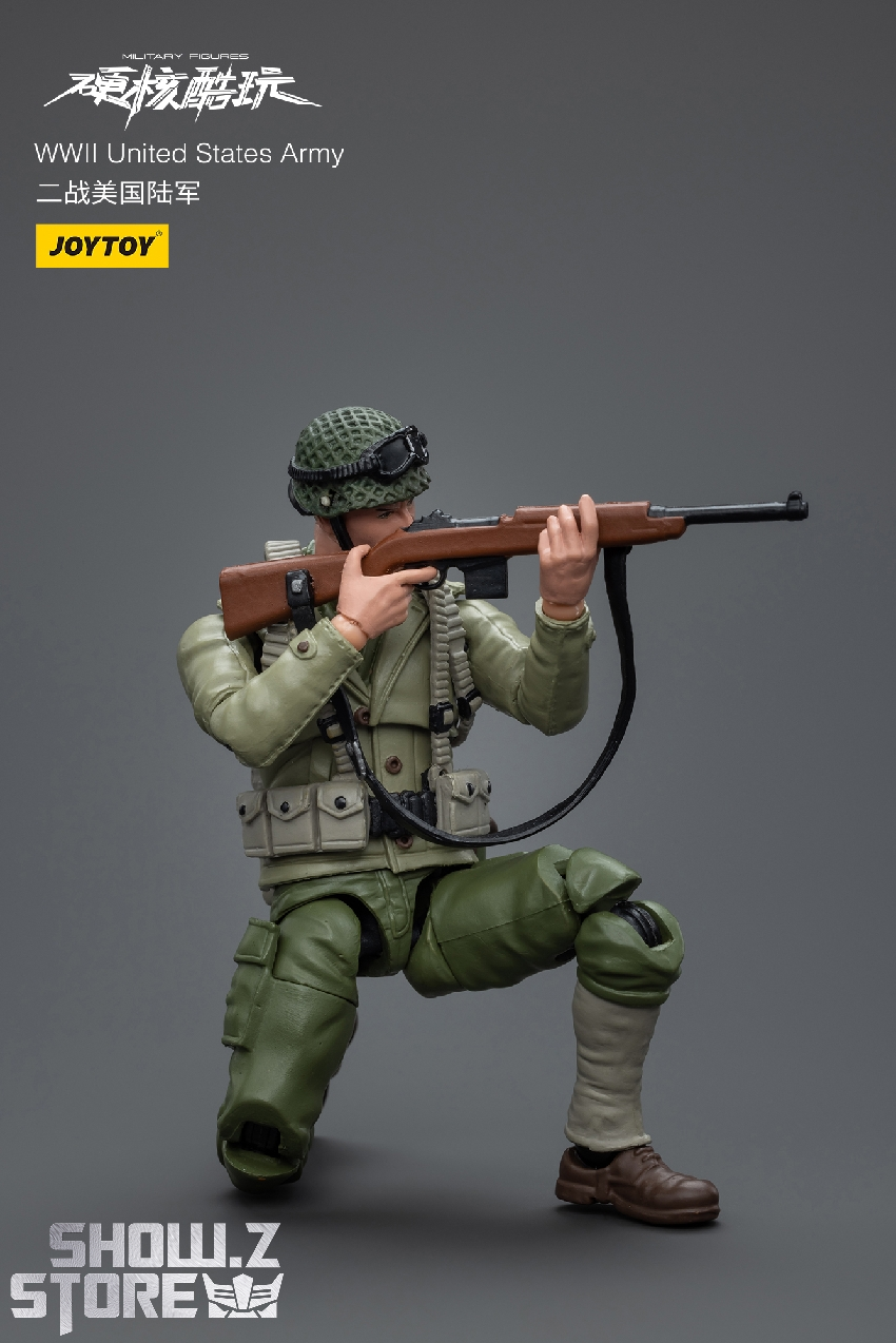 American WWII soldier in green uniform aiming rifle in combat stance American WWII soldier in green uniform aiming rifle in combat stance