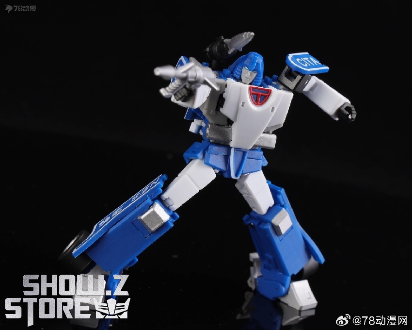 Transforming blue and white robot with articulated joints and weapons Transforming blue and white robot with articulated joints and weapons