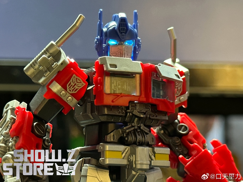 Red and blue Optimus Prime collectible figure with weapon accessories and standing base included Red and blue Optimus Prime collectible figure with weapon accessories and standing base included