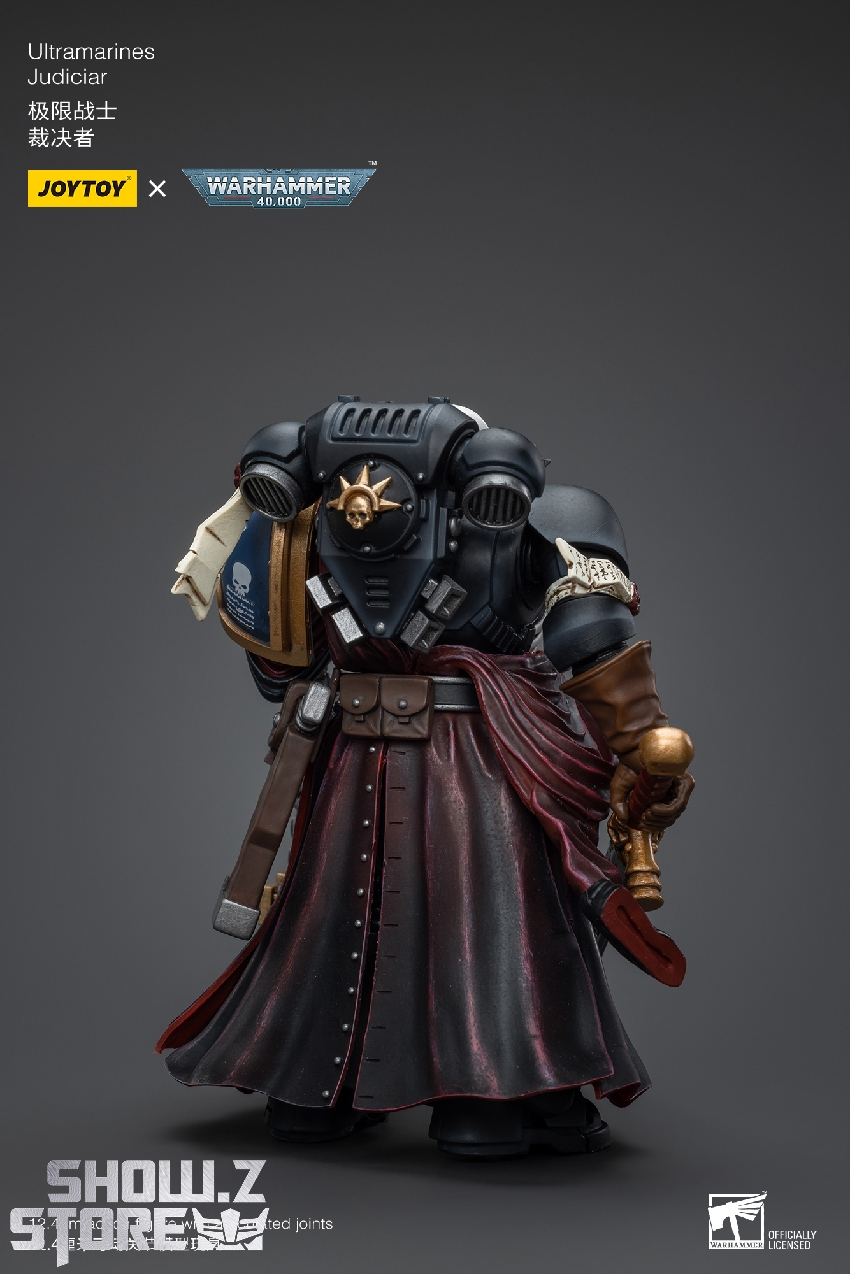 Dark-armored warrior with blue accents and melee weapons equipped Dark-armored warrior with blue accents and melee weapons equipped