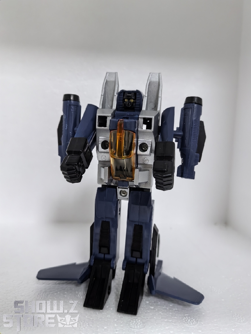 Navy and gold colored robot figure standing in upright humanoid character pose Navy and gold colored robot figure standing in upright humanoid character pose
