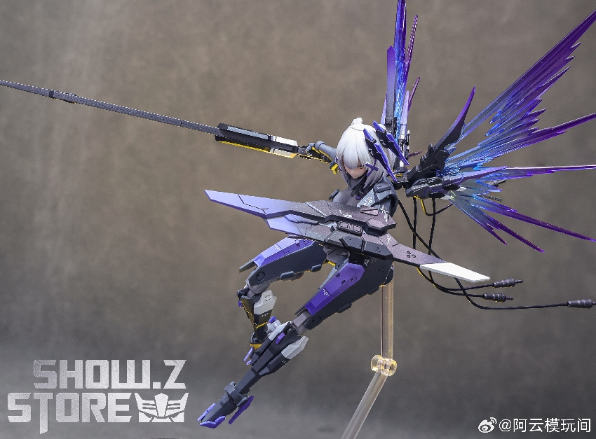 Purple white anime girl figure with extended crystalline energy blade weapons shown Purple white anime girl figure with extended crystalline energy blade weapons shown