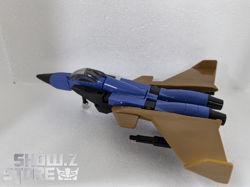 Blue and tan jet fighter aircraft transformation form Blue and tan jet fighter aircraft transformation form