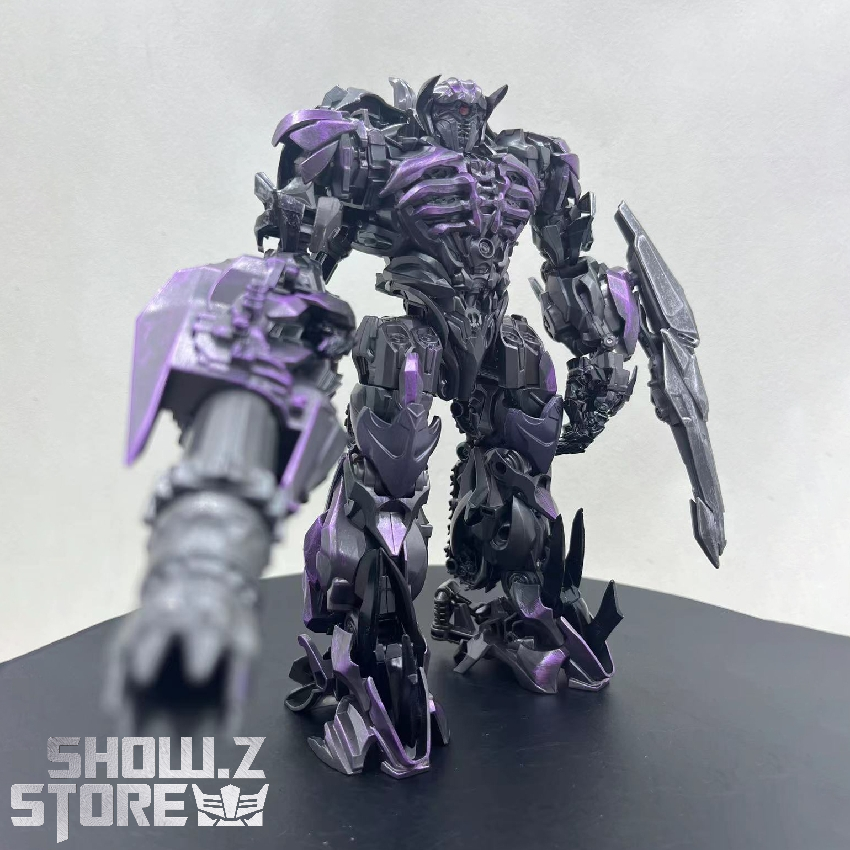 Purple and black articulated robot with layered armor design in standing pose Purple and black articulated robot with layered armor design in standing pose
