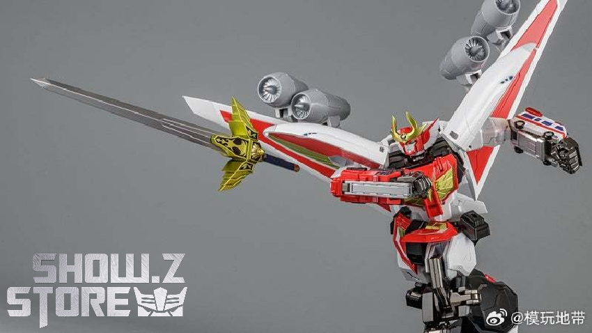 Red black and gold Metamor-Force Brave Command robot in dynamic flying pose with extended weapons Red black and gold Metamor-Force Brave Command robot in dynamic flying pose with extended weapons