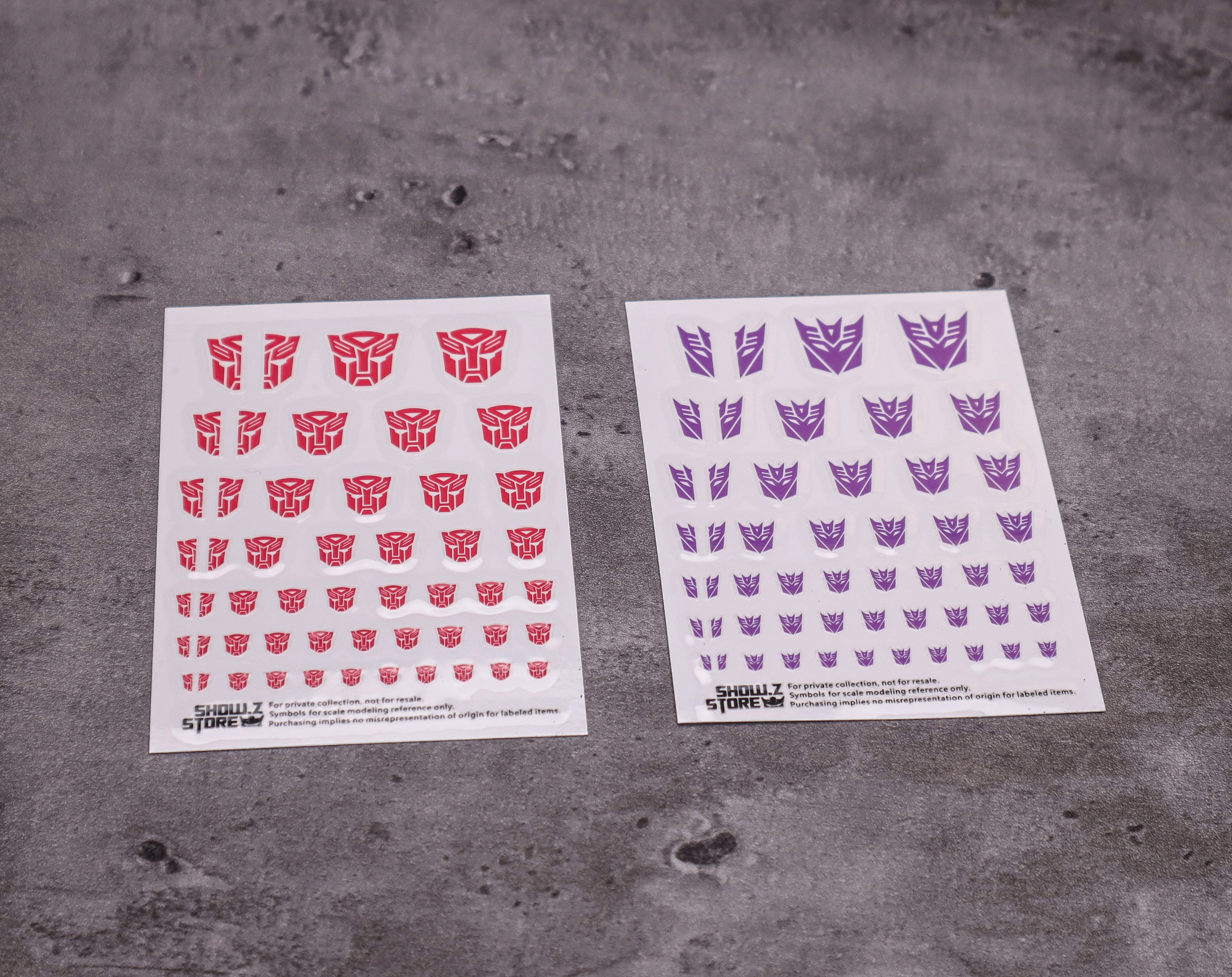Sticker sheet displaying faction logos in various sizes and color options Sticker sheet displaying faction logos in various sizes and color options