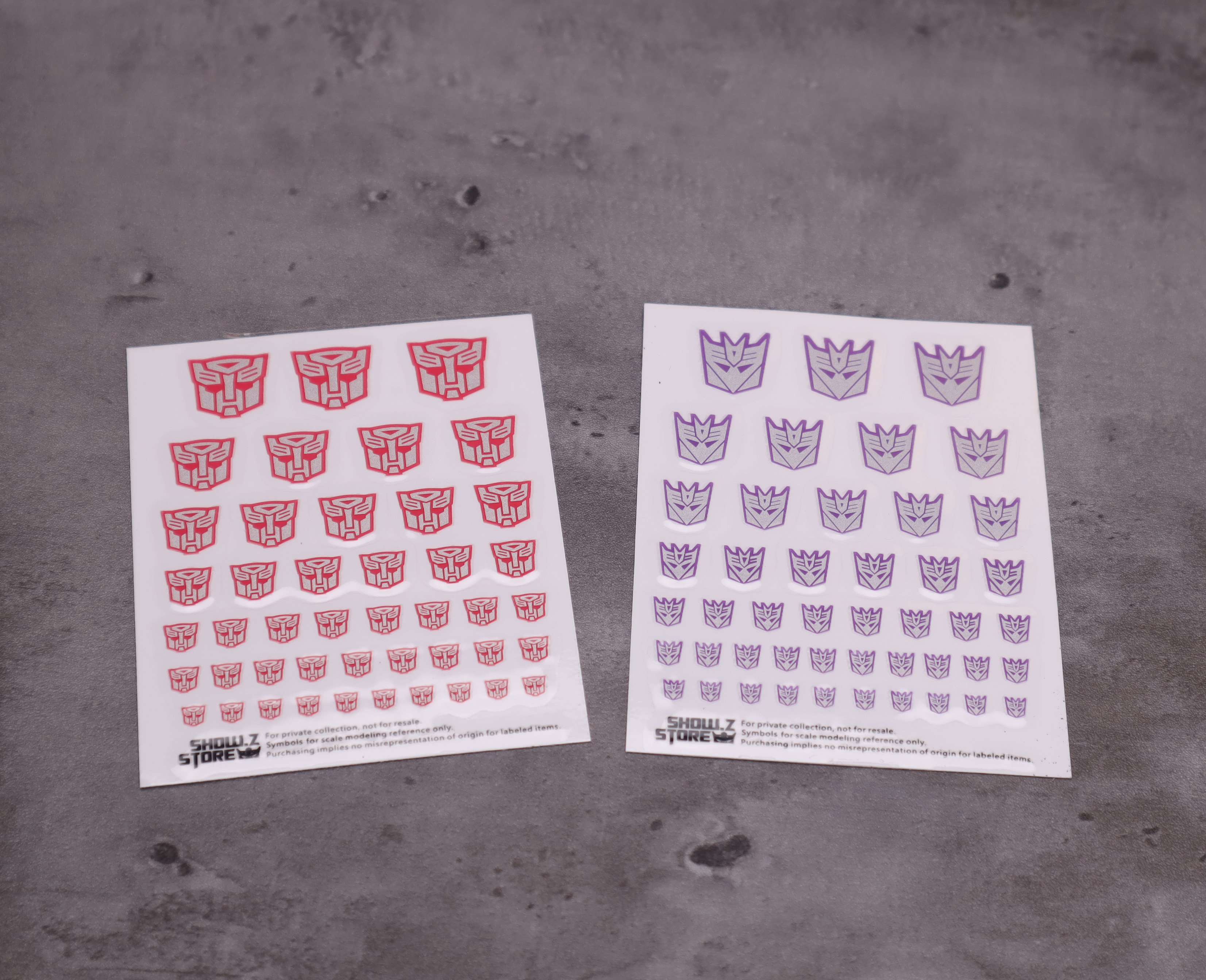 Detailed view of Transformers faction decal stickers on white background Detailed view of Transformers faction decal stickers on white background