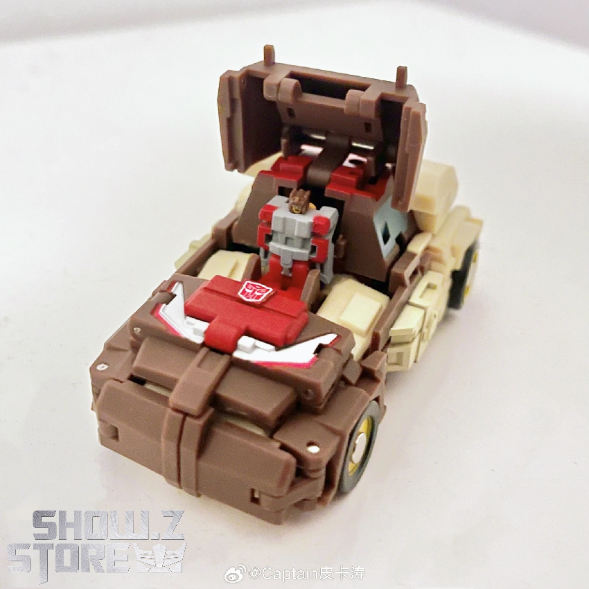 Brown Chromedome robot displayed in vehicle mode with red roof section Brown Chromedome robot displayed in vehicle mode with red roof section