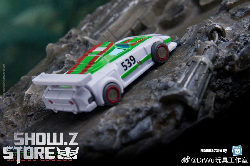 Green and white race car Transformers robot mode toy figure Green and white race car Transformers robot mode toy figure