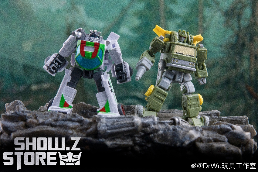 Two Transformers robots standing together on rocky terrain background Two Transformers robots standing together on rocky terrain background