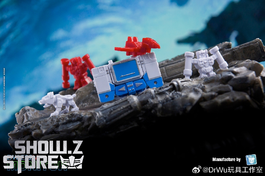 Blue and red Soundwave robot monitor on rocky terrain with dramatic sky Blue and red Soundwave robot monitor on rocky terrain with dramatic sky