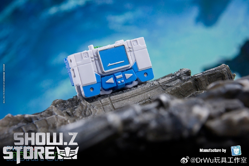 Dr.Wu Monitor Soundwave robot in vehicle mode on dark rocky surface Dr.Wu Monitor Soundwave robot in vehicle mode on dark rocky surface