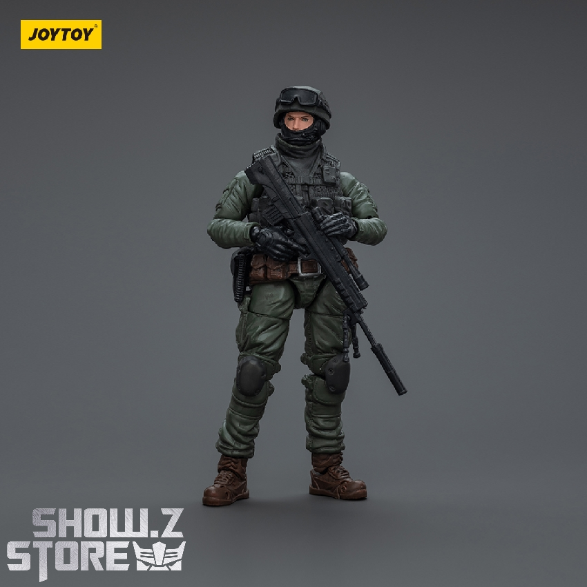 Combat-ready special operations soldier in camouflage with rifle aggressive stance Combat-ready special operations soldier in camouflage with rifle aggressive stance