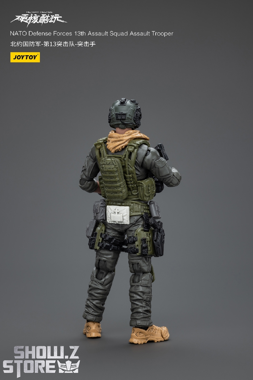 Tactical military soldier with helmet and automatic rifle combat stance Tactical military soldier with helmet and automatic rifle combat stance