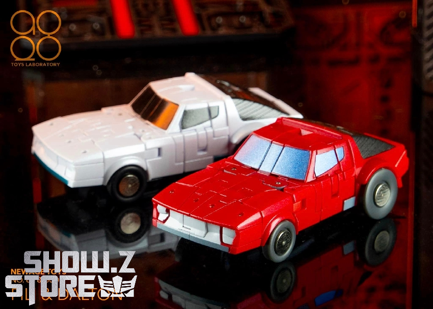 Two vehicle robots yellow and red car transformers posed together display Two vehicle robots yellow and red car transformers posed together display