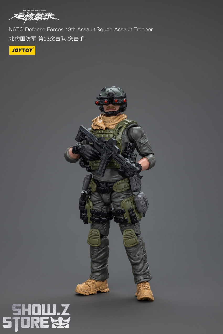 Nato Defense Force soldier with rifle and tactical vest dark background Nato Defense Force soldier with rifle and tactical vest dark background