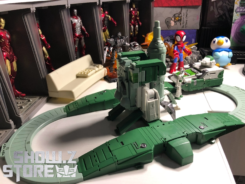 Complete defensive fortress configuration showing green robot base transformation Complete defensive fortress configuration showing green robot base transformation